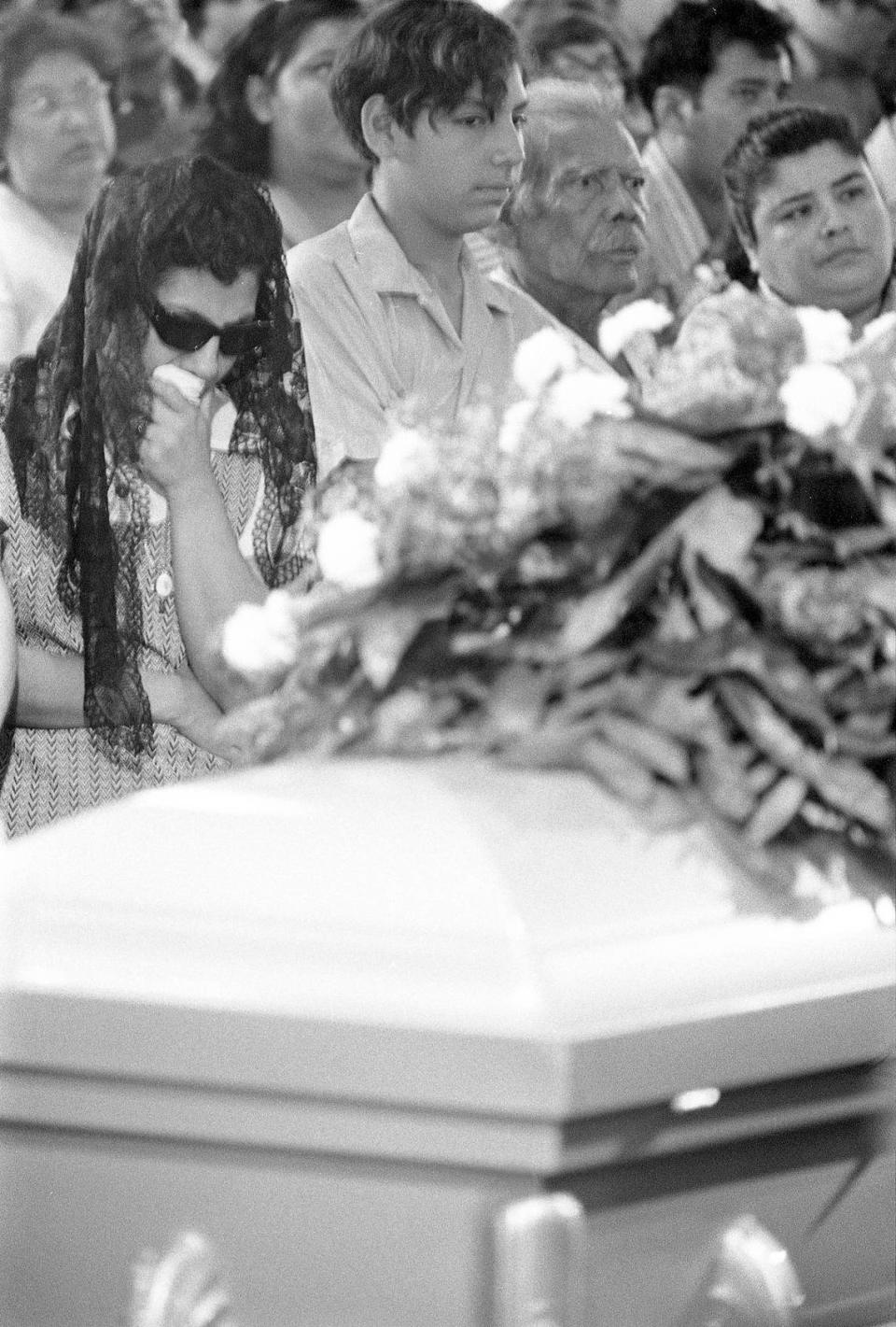 Bessie Rodriguez, David Rodriguez, and Carlos Minez, along with family and community mourners, attend Santos Rodriguez’s funeral on July 26, 1973. Courtesy/Dallas History & Archives Division, Dallas Public Library