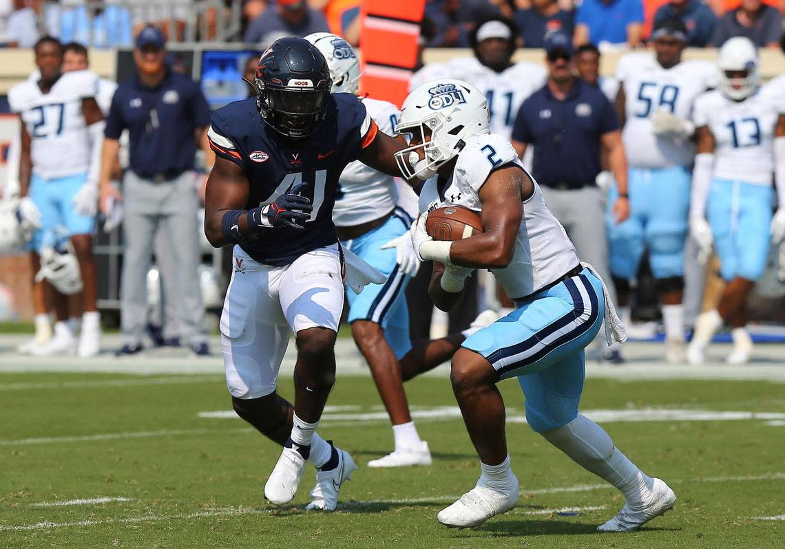 CHARLOTTESVILLE, VA - SEPTEMBER 17: Old Dominion Monarchs running back Blake Watson (2) rushes up field attempting to elude Virginia Cavaliers linebacker D’Sean Perry (41) during a college football game between the Old Dominion Monarchs and the Virginia Cavaliers on September 17, 2022, at Scott Stadium in Charlottesville, VA. (Photo by Lee Coleman/Icon Sportswire) (Icon Sportswire via AP Images)
