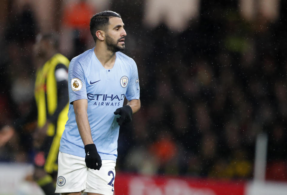 Manchester City's Riyad Mahrez celebrates after scoring his side's second goal during the English Premier League soccer match between Watford and Manchester City at Vicarage Road stadium in Watford, England, Tuesday, Dec. 4, 2018. (AP Photo/Frank Augstein)