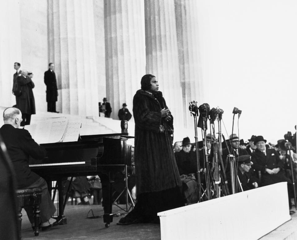 FILE - This April 9, 1939 file photo shows singer Marian Anderson performing on the steps of Washington's Lincoln Memorial on Easter Sunday after she had been refused permission to perform in Washington's Constitution Hall by the hall's owners, the Daughters of the American Revolution. For the first time, Marian Anderson’s orange-and-black blouse and skirt ensemble that she wore during her historic performance on the Lincoln Memorial steps 75 years ago will go on display at the Smithsonian. Anderson was a groundbreaking opera singer but was kept out of Washington’s Constitution Hall because she was black, and Eleanor Roosevelt invited her to perform at the Lincoln Memorial instead. The concert attire is part of a collection being donated to the National Museum of African American History and Culture by a member of Anderson’s extended family to mark the anniversary of Anderson’s concert on Wednesday. It will be displayed beginning Tuesday and will remain on view until September. (AP Photo, File)