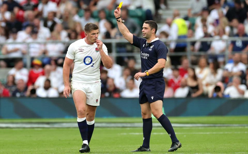 England's Owen Farrell reacts after being shown a yellow card by referee Nika Amashukeli following a high tackle on Wales' Taine Basham (not pictured) during the Summer International match between England and Wales at Twickenham Stadium on August 12, 2023 in London, England