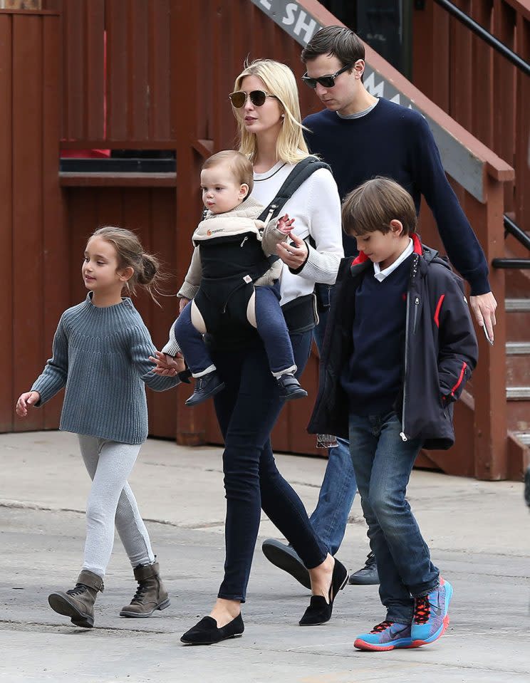 Ivanka Trump carries baby Theodore in an Ergobaby sling while walking with her husband, Jared Kushner, and daughter, Arabella. (Photo: Fame Flynet)