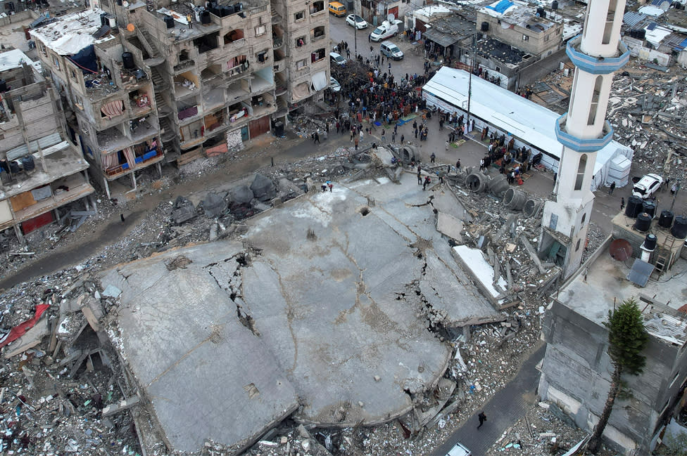 A drone view shows Palestinians holding Eid al-Fitr prayers by the ruins of al-Farouk mosque, amid the ongoing conflict between Israel and Palestinian Islamist group Hamas, in Rafah, in the southern Gaza Strip on 10 April 2024