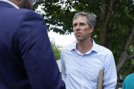 Beto O'Rourke, right, listens to a volunteer before a Texas Organizing Project neighborhood walk in West Dallas Wednesday, June 9, 2021. The former congressman and senatorial candidate is driving an effort to gather voter support to stop Texas' SB7 voting legislation. As politicians from Austin to Washington battle over how to run elections, many voters are disconnected from the fight. While both sides have a passionate base of voters intensely dialed in on the issue, a disengaged middle is baffled at the attention. (AP Photo/LM Otero)