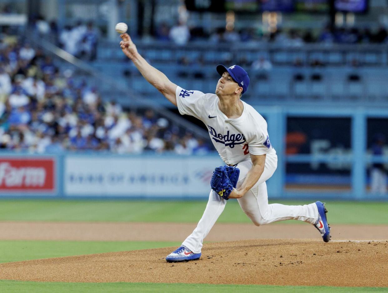 Walker Buehler throws the ball.