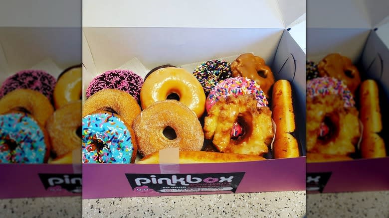 assorted donuts in pink box