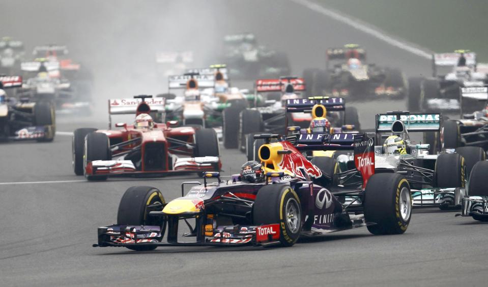 Red Bull Formula One driver Vettel leads the field on turn one of lap one during the Indian F1 Grand Prix at the Buddh International Circuit in Greater Noida