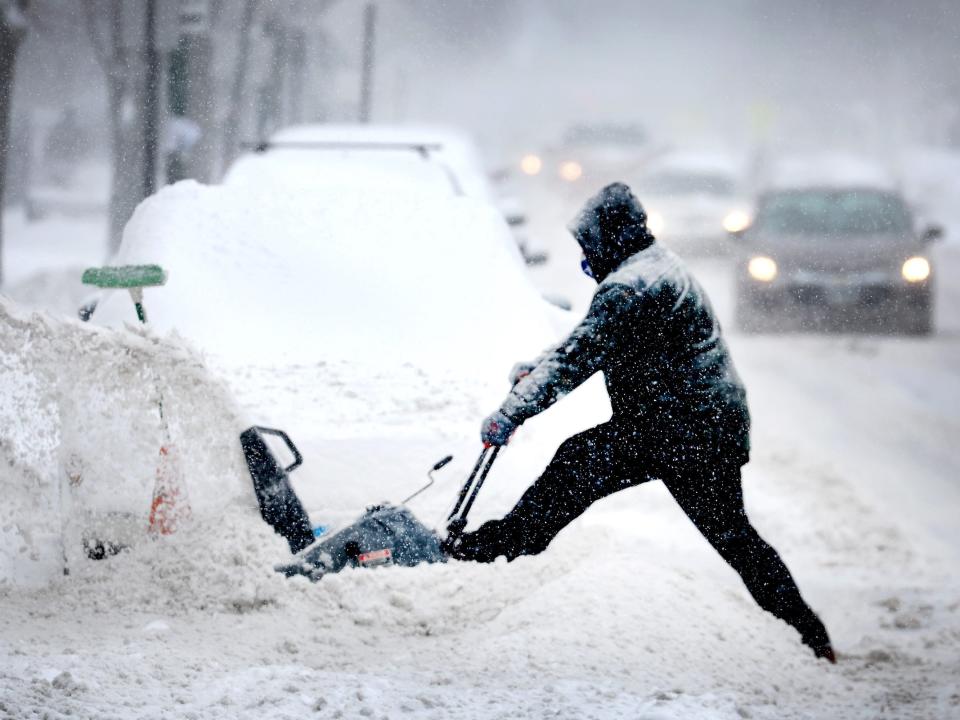 CHICAGO, ILLINOIS - FEBRUARY 02: A resident digs out his car on February 02, 2022 in Chicago, Illinois. A massive storm, working its way across the Midwest, is expected to dump as much as 16 inches of snow in some areas. Chicago is expected to receive between 4 and 8 inches by the time the system passes tomorrow afternoon.