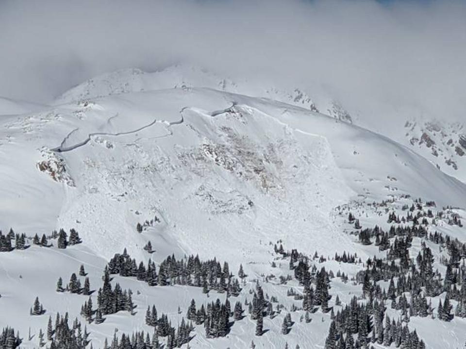 An avalanche takes down the side of a mountain near Winter Park, Colo., in 2021. <a href="https://newsroom.ap.org/detail/Rockies-AvalancheDanger/ebc1137f30c54ec29eace5443635401f/photo" rel="nofollow noopener" target="_blank" data-ylk="slk:Colorado Avalanche Information Center via AP;elm:context_link;itc:0;sec:content-canvas" class="link ">Colorado Avalanche Information Center via AP</a>