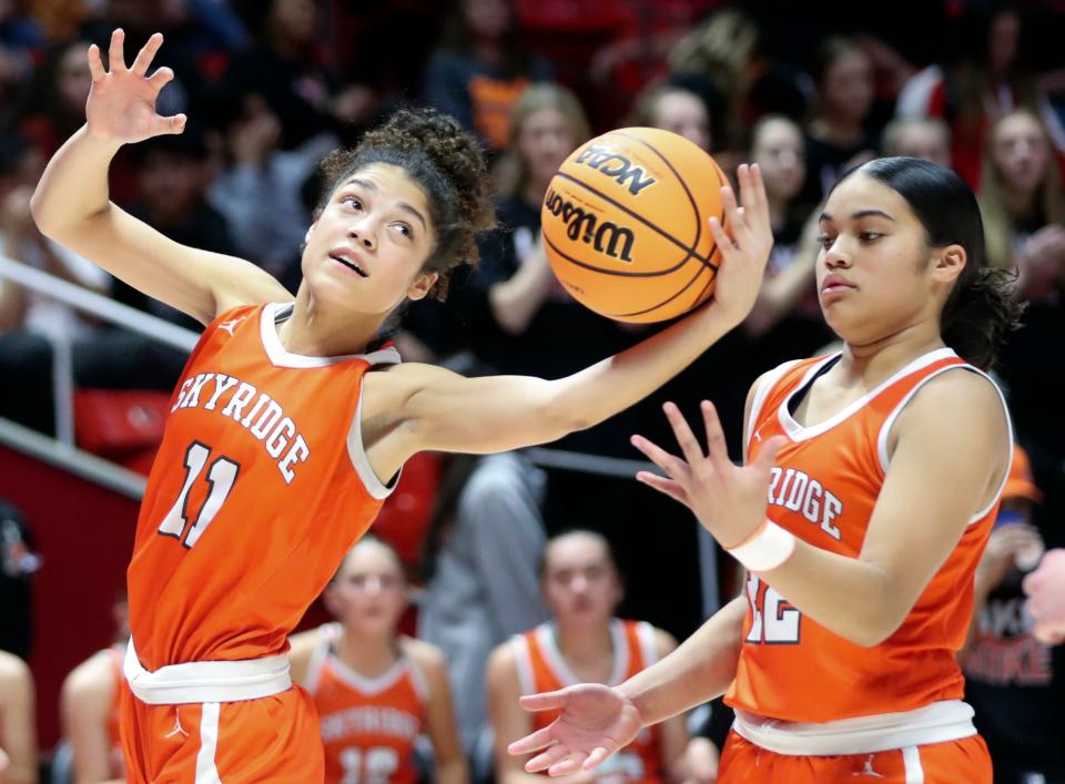 Skyridge’s Portia Hugh and Arianne Moeai reach for the ball during a 6A girls quarterfinal basketball game against Syracuse at the Huntsman Center in Salt Lake City on Monday, Feb. 26, 2024. | Kristin Murphy, Deseret News