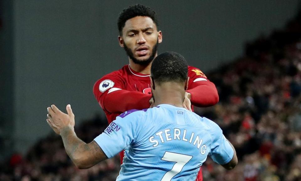 Liverpool’s Joe Gomez clashes with Raheem Sterling during his team’s victory over Manchester City on Sunday.