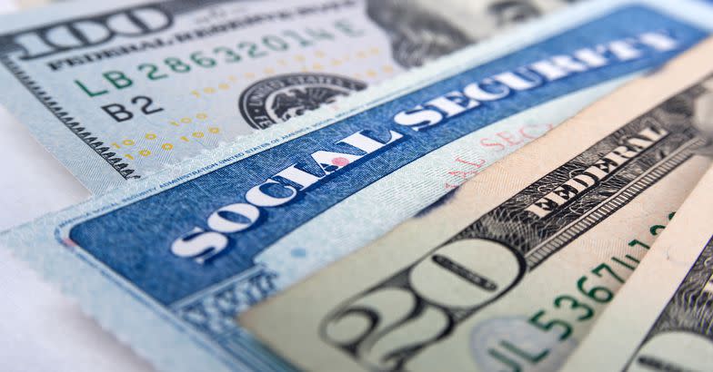 social security card and American money dollar bills