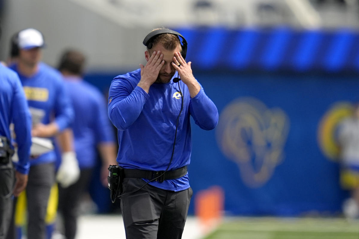 Sean McVay argues with officials as he wears a headset for the preseason broadcast