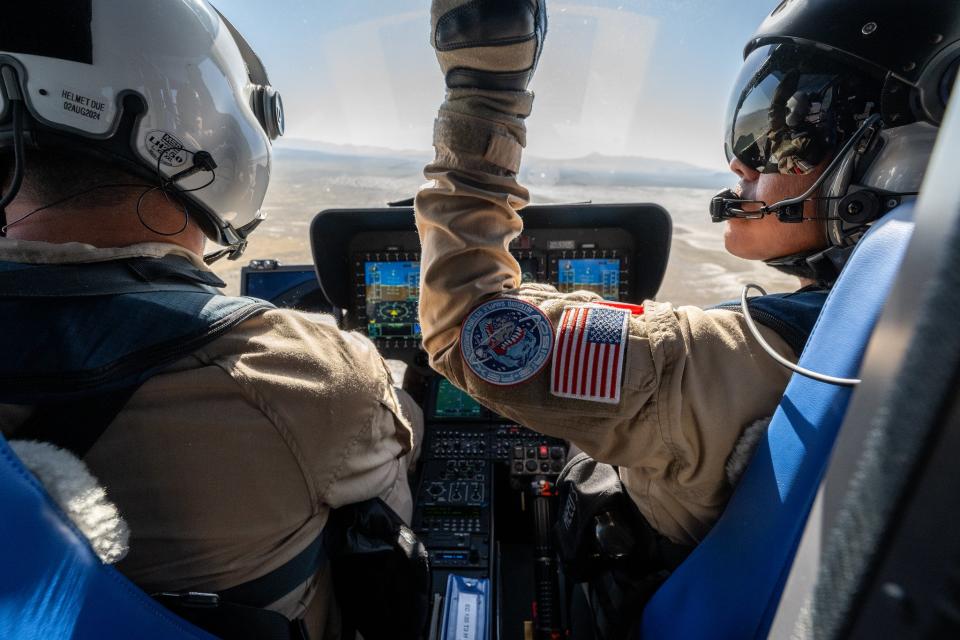 two pilots from inside a cockpit