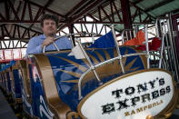 Alessandro Zamperla, president & CEO of Central Amusement International, sits in one of his new rides named after his grandfather Antonio at his company's construction site in the amusement park district of Coney Island, Friday, June 17, 2022, in the Brooklyn borough of New York. Luna Park in Coney Island will open three new major attractions this season alongside new recreational areas and pedestrian plazas. (AP Photo/John Minchillo)