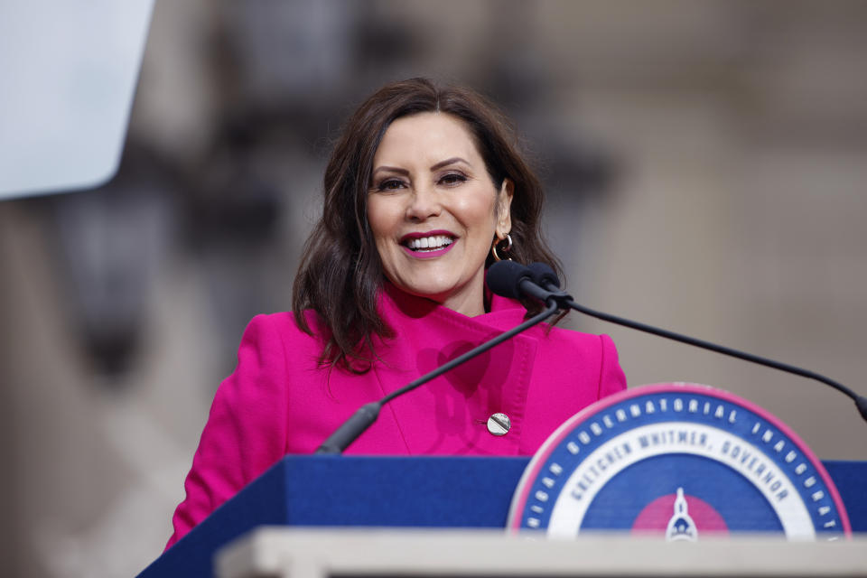 Michigan Gov. Gretchen Whitmer addresses the crowd during inauguration ceremonies, Sunday, Jan. 1, 2023, outside the state Capitol in Lansing, Mich. (AP Photo/Al Goldis)