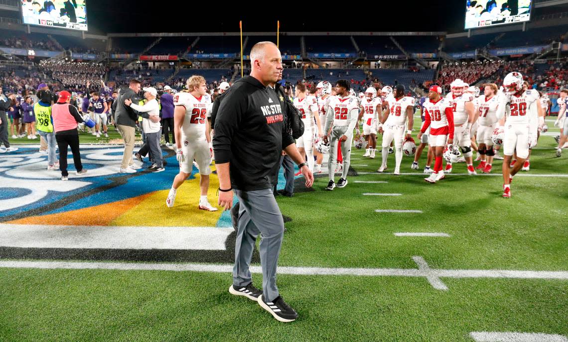 N.C. State head coach Dave Doeren walks off the field after Kansas State’s 28-19 victory over N.C. State in the Pop-Tarts Bowl at Camping World Stadium in Orlando, Fla., Thursday, Dec. 28, 2023. Ethan Hyman/ehyman@newsobserver.com