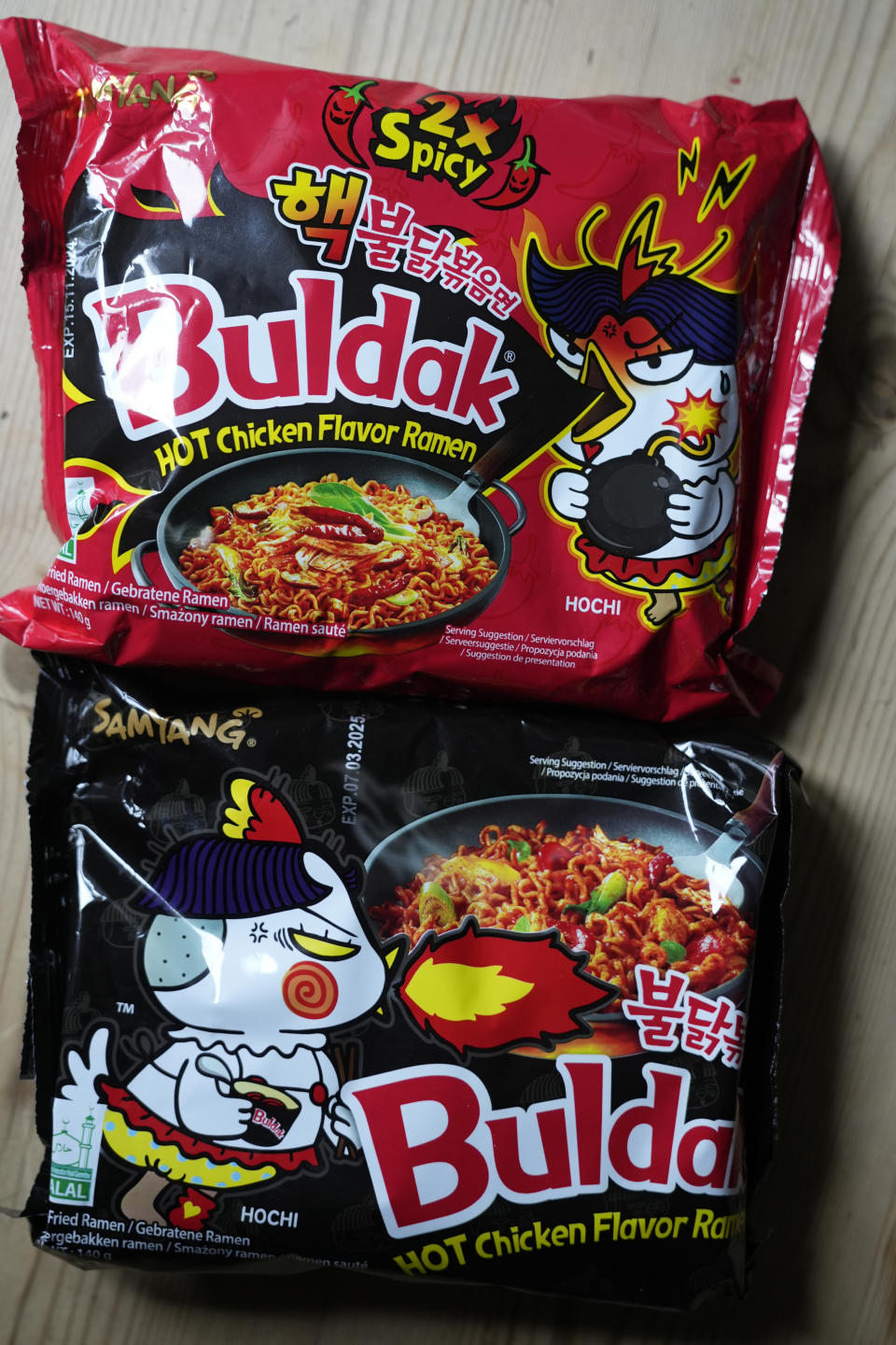 In this photo illustration two packets of Samyang noodles are pictured in London, Wednesday, June 12, 2024. Food authorities in Denmark have recalled three types of spicy instant noodle products imported from South Korea over possible risks for “acute poisoning.” (AP Photo)