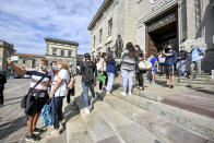 Members of Noi Denunceremo (We will denounce) group arrive at Bergamo's court, Italy, Monday, July 13, 2020. Lawyers for the Noi Denunceremo (We Will Denounce) Facebook group and an affiliated non-profit committee are filing 100 new cases Monday with Bergamo prosecutors investigating the outbreak, on top of 50 complaints lodged last month. ( Claudio Furlan/LaPresse via AP)