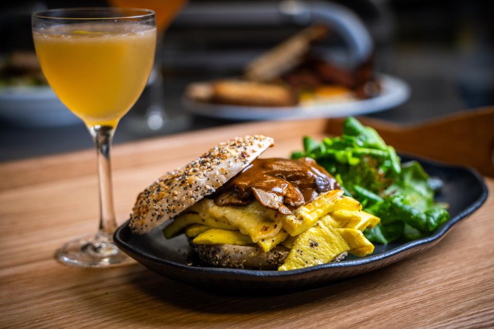 A breakfast sandwich paired with a cocktail at the Tailor and the Cook's Sunday brunch.