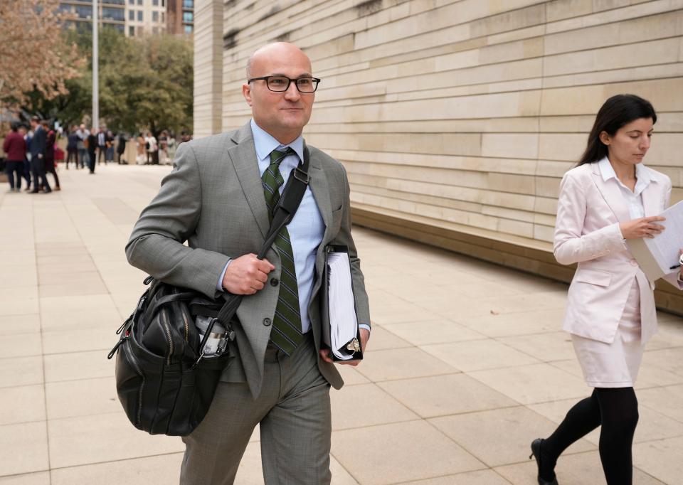 Ryan Walters of the Texas attorney general's office leaves after Thursday's court hearing where he defended SB 4.