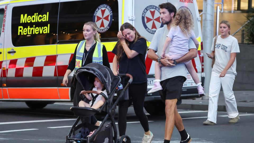 A woman cries as she comes out of the Westfield Bondi Junction shopping mall after a stabbing incident in Sydney on April 13, 2024. - David Gray/AFP/Getty Images