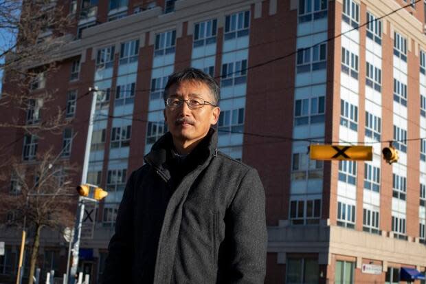 Ross Ha visits with his 88-year-old mother at the Rose of Sharon Korean Long-Term Care Home, in Toronto, on March 2, 2021.