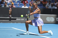 Leylah Fernandez of Canada plays a forehand return to Sara Bejlek of the Czech Republic during their first round match at the Australian Open tennis championships at Melbourne Park, Melbourne, Australia, Sunday, Jan. 14, 2024. (AP Photo/Asanka Brendon Ratnayake)