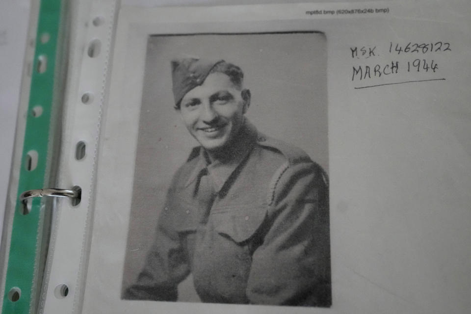 A copy of a photograph of Mervyn Kersh D-Day veteran who fought in the Normandy Campaign, in his uniform, in London, Monday, April 8, 2024. A Jewish veteran is preparing to commemorate the 80th anniversary of the D-Day landings. Pvt. Mervyn Kersh was summoned by his commanding officer and threatened with arrest even as he prepared to embark for the battlefields of Normandy eight decades ago. (AP Photo/Kirsty Wigglesworth)