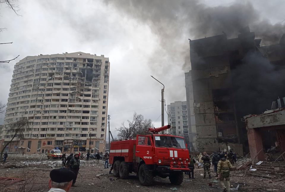 Firefighters work to extinguish a fire at a damaged city center after Russian air raid in Chernigiv, Ukraine, on March 3, 2022.