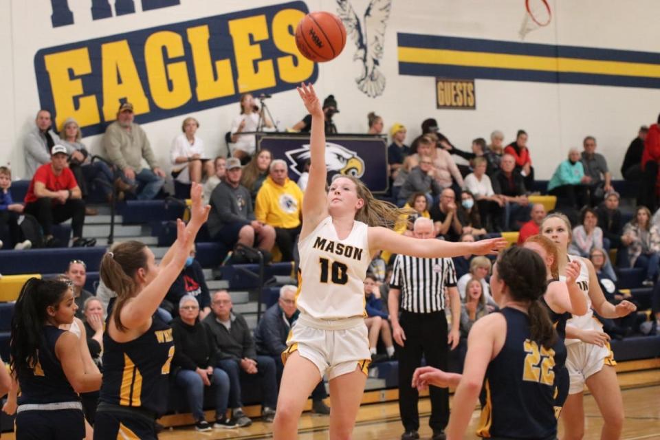 Jenna Wright of Erie Mason shoots over the Whiteford defense Friday night. Mason won 50-42.