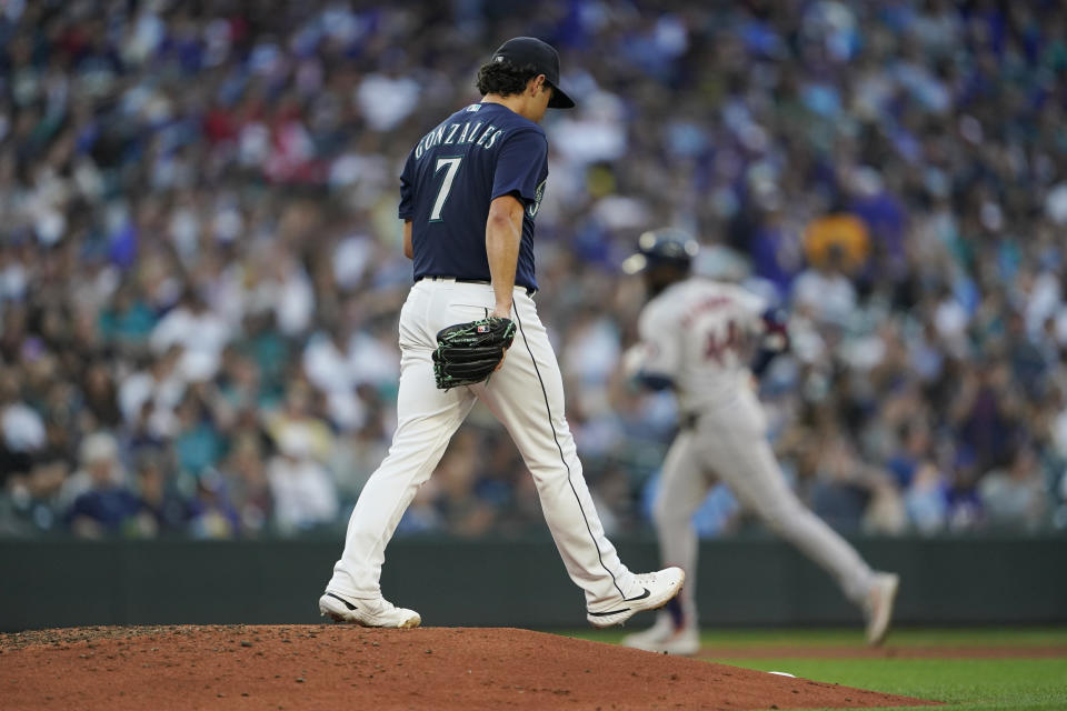 Seattle Mariners starting pitcher Marco Gonzales (7) stands on the mound as Houston Astros' Yordan Alvarez rounds the bases after hitting a solo home run during the fourth inning of a baseball game, Friday, July 22, 2022, in Seattle. (AP Photo/Ted S. Warren)