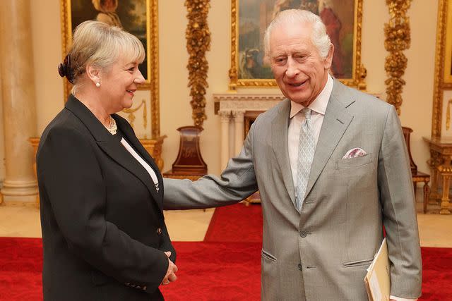 <p>Jonathan Brady - WPA Pool/Getty Images</p> King Charles with Dame Martha Milburn at Buckingham Palace on March 26, 2024