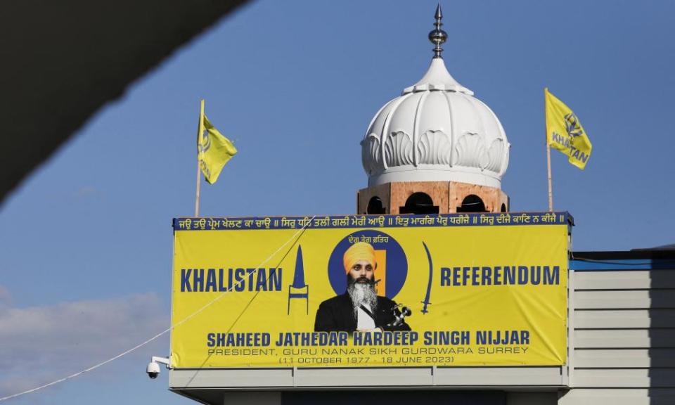 A banner with an image of Nijjar is seen at the Guru Nanak Sikh gurdwara, the site of his June 2023 killing, in Surrey, British Columbia, Canada