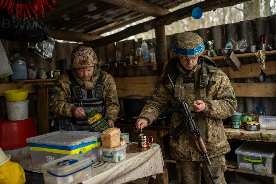 FILE - Soldiers of Ukraine's state border guard have a break for tea at a military position in the Sumy region of Ukraine, Friday, Nov. 24, 2023. After blunting Ukraine's counteroffensive from the summer, Russia is building up its resources for a new stage of the war over the winter, which could involve trying to extend its gains in the east and deal significant blows to the country's vital infrastructure. Russia has ramped up its pressure on Ukrainian forces on several parts of the more than 1,000-kilometer (620-mile) front line. (AP Photo/Hanna Arhirova, File) ORG XMIT: XEST907
