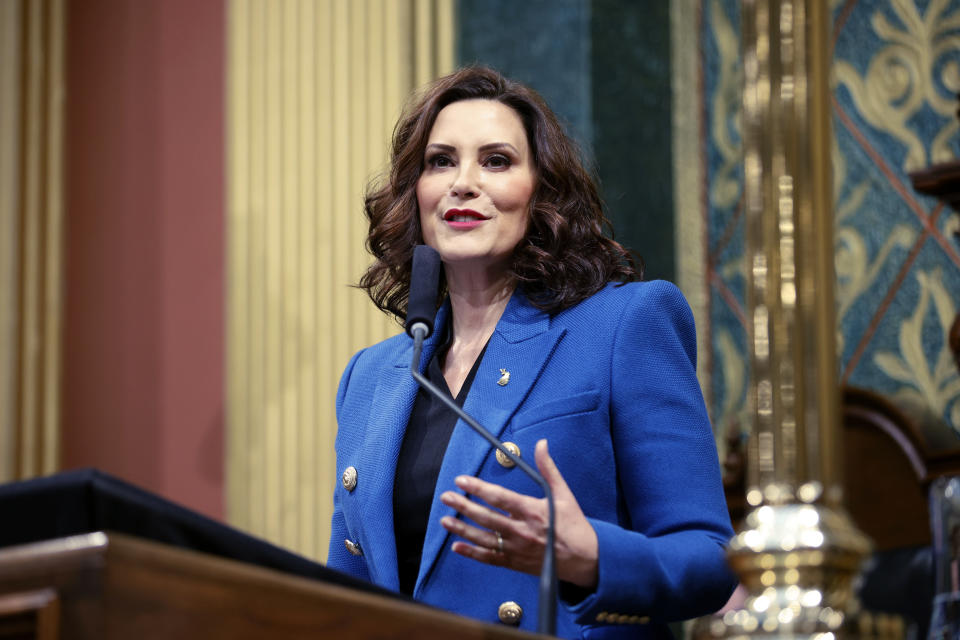 FILE - Michigan Gov. Gretchen Whitmer delivers her State of the State address to a joint session of the House and Senate, Jan. 25, 2023, at the state Capitol in Lansing, Mich. Michigan will join four other states in requiring utility providers to transition to 100% carbon-free energy generation by 2040 under legislation that will soon be signed by Whitmer. (AP Photo/Al Goldis, File)