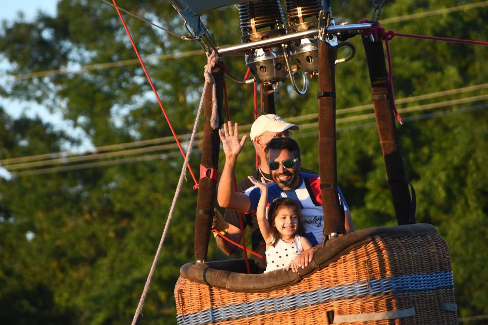 Milana Patel, 3 1/2, was all smiles as she excitedly waved to onlookers below as she and her dad Parry Patel floated up in air.

"She loved it," said her dad Parry Patel. "She wanted to go again."