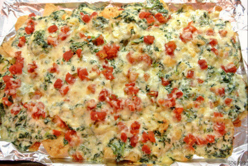 <strong>Get the <a href="http://thesmartcookiecook.com/2012/05/17/spinach-artichoke-nachos/">Spinach Artichoke Nachos recipe from The Smart Cookie Cook</a></strong>