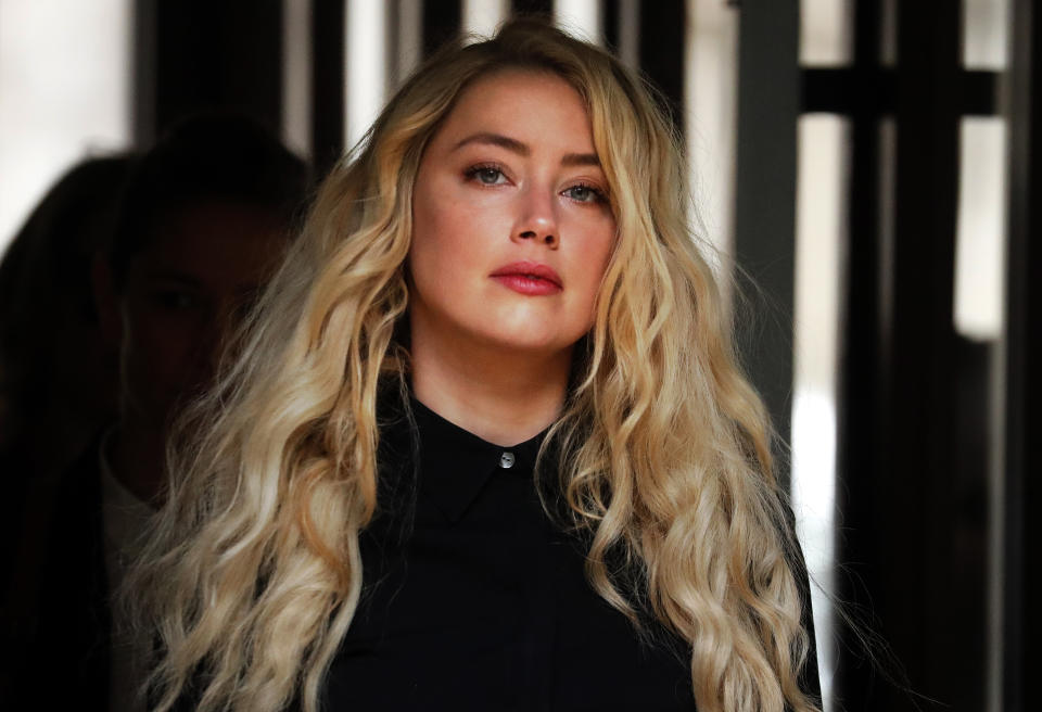 US Actress Amber Heard, former wife of actor Johnny Depp, arrives at the High Court in London, Tuesday, July 28, 2020. Hollywood actor Johnny Depp is suing News Group Newspapers over a story about his former wife Amber Heard, published in The Sun in 2018 which branded him a 'wife beater', a claim he denies. (AP Photo/Frank Augstein)