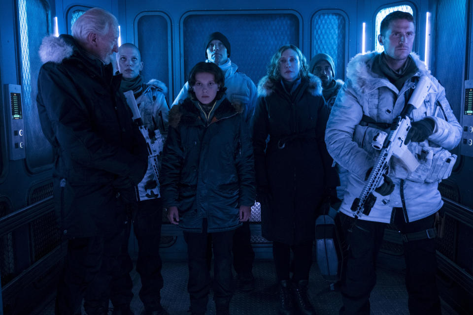 (L-R) CHARLES DANCE as Alan Jonah, TRACIE GARRISON as Asaj, MILLIE BOBBY BROWN as Madison Russell, ZAC ZEDALIS as Sergeant Travis, VERA FARMIGA as Dr. Emma Russell, JOSHUA LEARY as Sergeant Baker and JONATHAN HOWARD as Asher Jonah “GODZILLA: KING OF THE MONSTERS,” a Warner Bros. Pictures release.