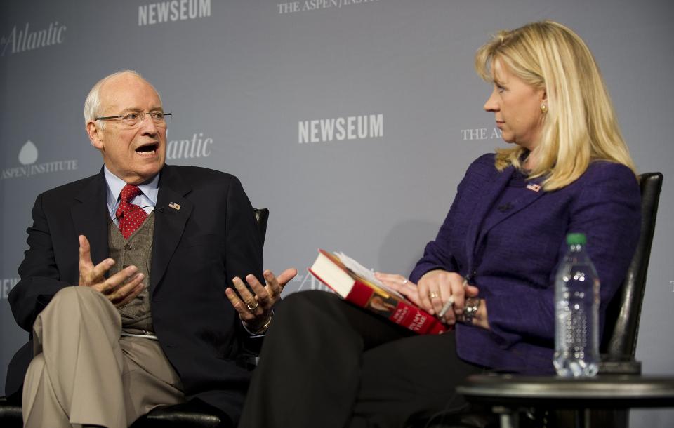 Former U.S. Vice President Dick Cheney (L) speaks with his daughter Liz during the 2011 Washington Ideas Forum at the Newseum in Washington, DC, October 6, 2011. (JIM WATSON/AFP/Getty Images)