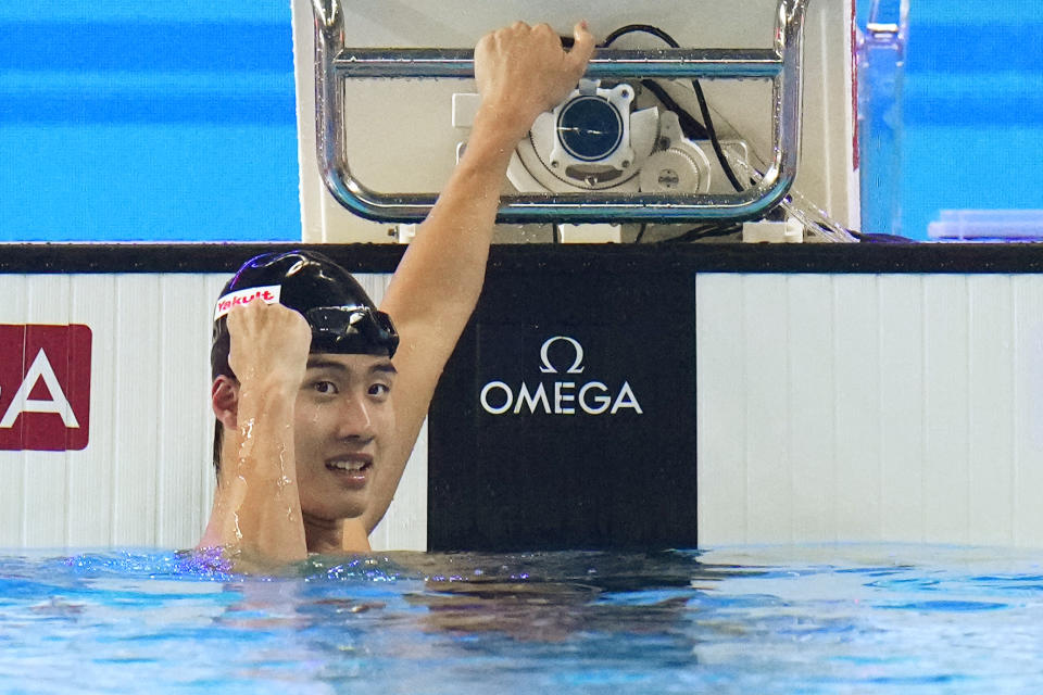 Hwang Sun-Woo of South Korea celebrates after winning in the men's 200-meter freestyle final at the World Aquatics Championships in Doha, Qatar, Tuesday, Feb. 13, 2024. (AP Photo/Hassan Ammar)