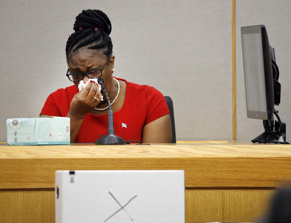 Botham Jean's mother, Allison Jean, cries while speaking about her son during sentencing testimony for former Dallas Police Officer Amber Guyger in 204th District Court at the Frank Crowley Courts Building in Dallas, Tuesday, Oct. 1, 2019. Guyger, who shot her black unarmed neighbor Botham Jean to death after, she said, mistaking his apartment for her own, was convicted of murder Tuesday. (Tom Fox/The Dallas Morning News via AP, Pool)