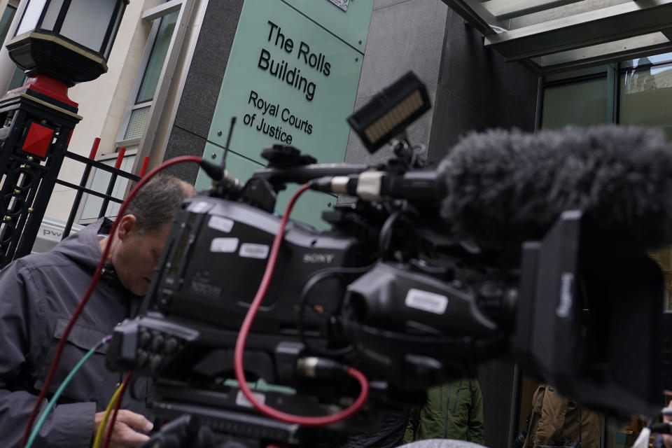 Media waits outside the High Court for the expected arrival of Prince Harry in London, Monday, June 5, 2023. Prince Harry has five active legal cases, three of them involving his battle with the British tabloids. He is expected to testify in London's High Court; if he takes the witness stand, he'll be the first member of the royal family to testify in court since the late 19th century. (AP Photo/Alberto Pezzali)