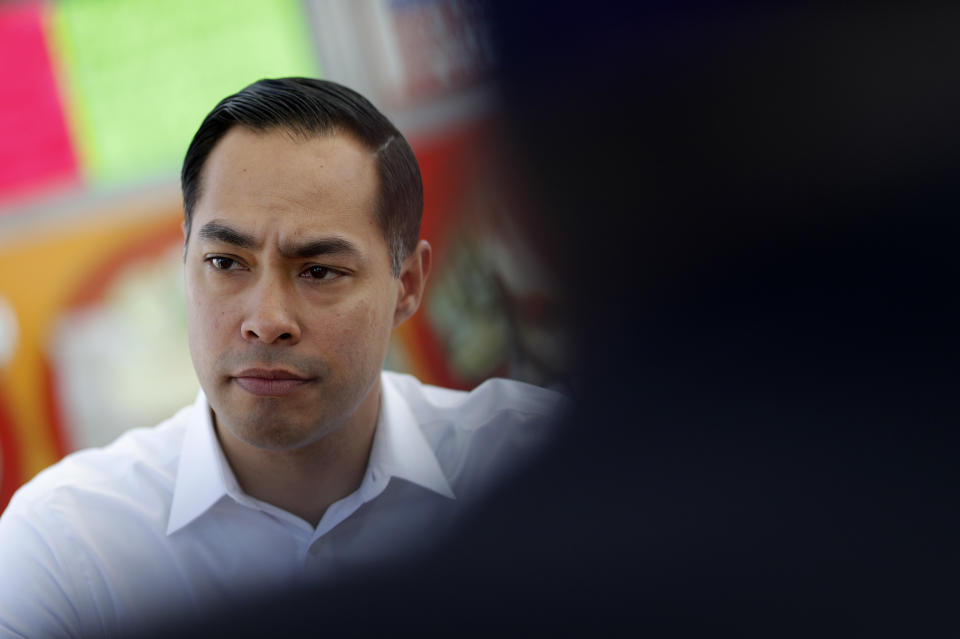 FILE - In this Feb. 28, 2019 file photo, former Housing and Urban Development Secretary and Democratic presidential candidate Julian Castro visits with people at a taco truck in North Las Vegas, Nev. Democratic presidential candidate Julian Castro says the Latino community's bilingual, ambitious youth are one of America's best assets to remain competitive in the world. Castro made the comments at a luncheon Friday, March 15, 2019, before Latino business leaders in Las Vegas as he made his third visit to Nevada as a 2020 hopeful. (AP Photo/John Locher, File)