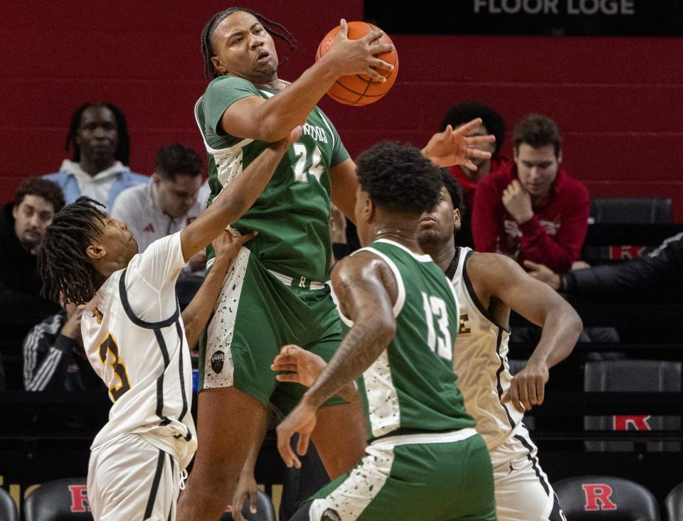 Richwoods’ Lathan Sommerville comes down with a rebound. Richwoods Knights vs College Achieve Knights of Asbury Park in The Battle basketball series at Rutgers on December 29, 2023.