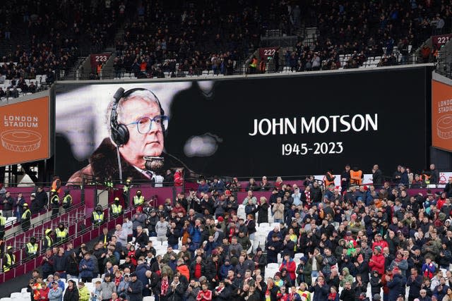 A tribute to John Motson is displayed on a screen before the Premier League match at the London Stadium