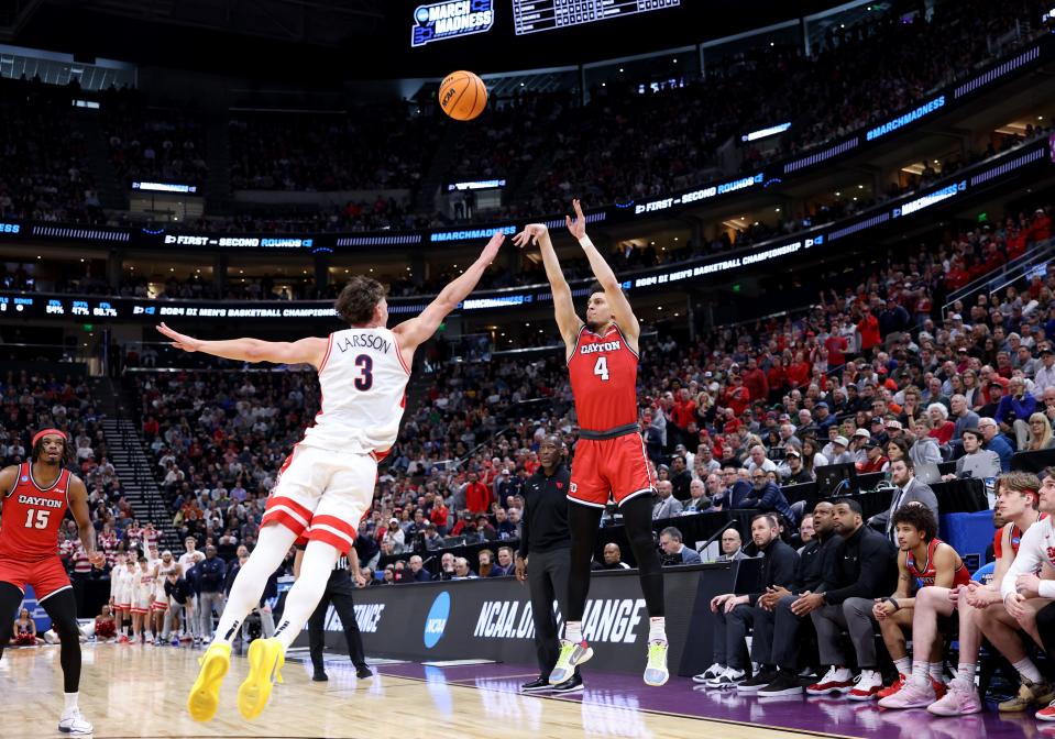 Mar 23, 2024; Salt Lake City, UT, USA; Dayton Flyers guard Koby Brea (4) shoots against Arizona Wildcats guard Pelle Larsson (3) during the second half in the second round of the 2024 NCAA Tournament at Vivint Smart Home Arena-Delta Center. Mandatory Credit: Rob Gray-USA TODAY Sports