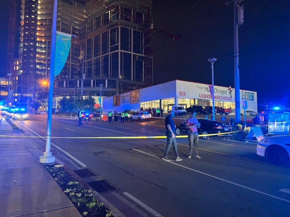 A large police presence blocked traffic on Division Street and 8th Avenue on Thursday, June 2, 2022, after a liquor store security guard was fatally shot.