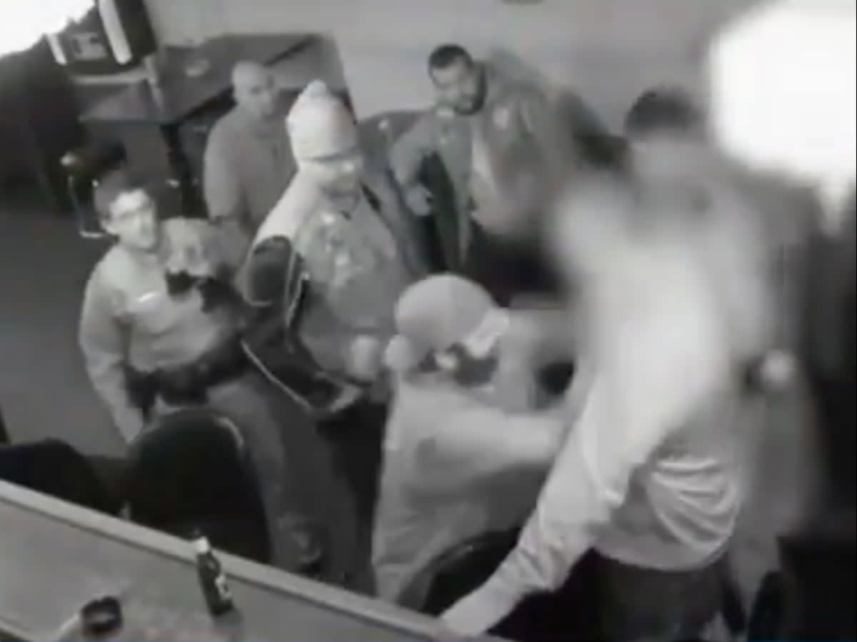 Surveillance footage shows Frank Deluca of the Pagans Motorcycle Club fighting with an undercover Pittsburgh police officer inside Kopy’s bar (screengrab/ Martin Dietz)